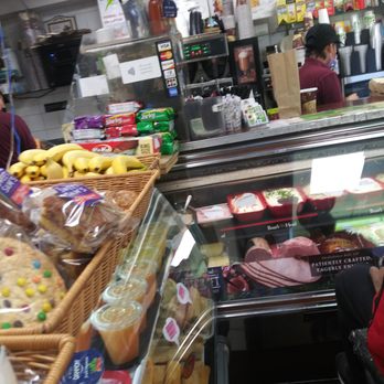 Bagel Buffet - a woman standing in front of the counter - Bagels Near Me - New York, New York Bagel Buffet - a woman standing in front of the counter - Bagels Near Me - New York, New York