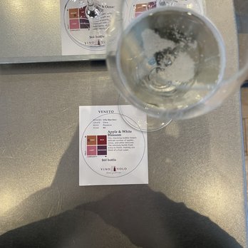 Vino Volo - a glass of wine with a label on it - Wine Bars Near Me - Calgary, Alberta
