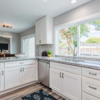 Thompson Construction - a kitchen with white cabinets and granite countertops - Cabinetry Near Me - Rocklin, California Thompson Construction - a kitchen with white cabinets and granite countertops - Cabinetry Near Me - Rocklin, California