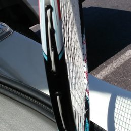 Badminton racket stringing. Got at least 3 places where strings overlapping each other outside the frame. Very bad stringing quality.