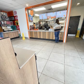 Popeyes Louisiana Kitchen - a woman standing in front of a counter - Fast Food Near Me - Shawnee, Oklahoma
