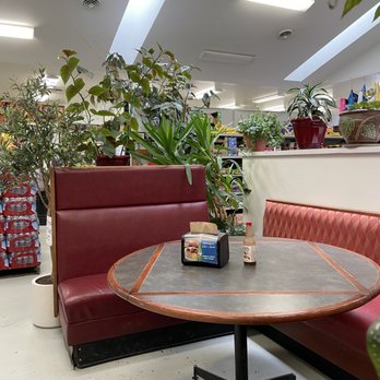 Jakes Meats - a table and booth in a store - Tacos Near Me - Quincy, Washington