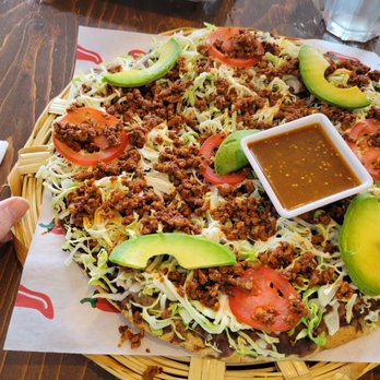 Casa Oaxaca - a hand holding a plate of mexican food - Mexican Near Me - Edmonds, Washington Casa Oaxaca - a hand holding a plate of mexican food - Mexican Near Me - Edmonds, Washington