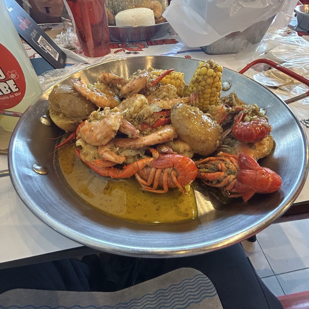 Seau de Crabe - Shrimp and crawfish bucket with corn and potatoes in Seau de Crabe's signature sauce - Seafood Near Me - Mississauga, Ontario Seau de Crabe - Shrimp and crawfish bucket with corn and potatoes in Seau de Crabe's signature sauce - Seafood Near Me - Mississauga, Ontario