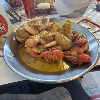 Seau de Crabe - Shrimp and crawfish bucket with corn and potatoes in Seau de Crabe's signature sauce - Seafood Near Me - Mississauga, Ontario Seau de Crabe - Shrimp and crawfish bucket with corn and potatoes in Seau de Crabe's signature sauce - Seafood Near Me - Mississauga, Ontario