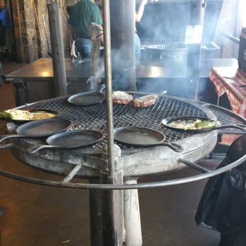 Hard Eight BBQ - The grill in plain site. The smell of mesquite burning is like an afrodesiac... for hunger. - Barbeque Near Me - Roanoke, Texas