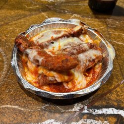 Corrado's Pizza and Wings - I ordered Chicken Parmigiana dinner... what I got was deep fried chicken finger covered in sauce and cheese!!