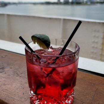 The Observation Bar - a red cocktail with a lime garnish - Bars Near Me - Long Beach, California