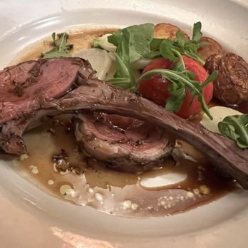 Chez Panisse - Riverdog Farm Lamb rack and loin grilled with lemon and cumin; with New Girl tomato confit, roasted potatoes, and Tokyo turnips - New American Near Me - Berkeley, California