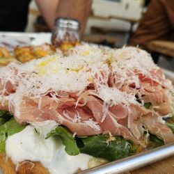 Chill Since 93 - Prosciutto- burrata -arugula pizza.