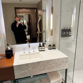 the DOUGLAS, Autograph Collection - A luxurious bathroom (please disregard that man in the photo) - Hotels Near Me - Vancouver, British Columbia the DOUGLAS, Autograph Collection - A luxurious bathroom (please disregard that man in the photo) - Hotels Near Me - Vancouver, British Columbia