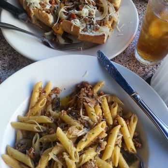 Romano Cucina - Spicy Italian Sausage Sandwich and Pasta Tombrello w/Penne. - Italian Near Me - Sunset Beach, California