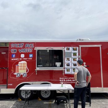 Sticky Rice on Wheels - a man standing in front of a food truck - Food Trucks Near Me Sticky Rice on Wheels - a man standing in front of a food truck - Food Trucks Near Me