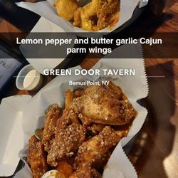 The Green Door Tavern - Crazy about the butter garlic Cajun parm wings. Won't get the extremely salty lemon pepper wings again.