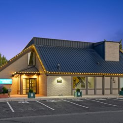 Coldwell Banker Mountain West Real Estate, Inc. - Exterior front entrance with lighted sign.