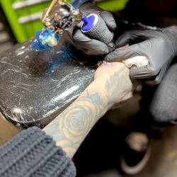 Envision Tattoo Studio - Anthony tattooing my sister