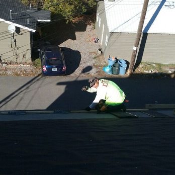Zootown Construction - a man working on a roof - Roofing Near Me - Missoula, Montana Zootown Construction - a man working on a roof - Roofing Near Me - Missoula, Montana