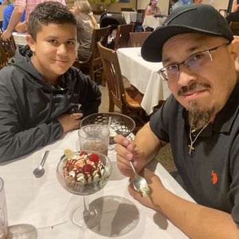 Giuseppe's - The Rodriguez family with a picture of the Spumoni - Italian Near Me - Spring, Texas