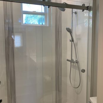 Exquisite Remodels - Modern sliding shower door - General Contractors Near Me