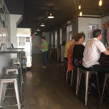 Beer Love - a group of people sitting at a bar - Beer, Wine & Spirits Near Me - Philadelphia, Pennsylvania