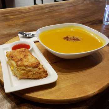 Ravi Soups - Butternut squash soup with fried shallots and a homemade biscuit! Everything was perfect! - Sandwiches Near Me - Toronto, Ontario