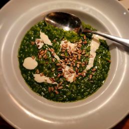 Spinach risotto with crema and sunflower seeds