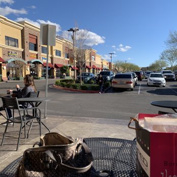 Popped - a woman sitting at a table outside of a restaurant - Popcorn Shops Near Me - Las Vegas, Nevada Popped - a woman sitting at a table outside of a restaurant - Popcorn Shops Near Me - Las Vegas, Nevada