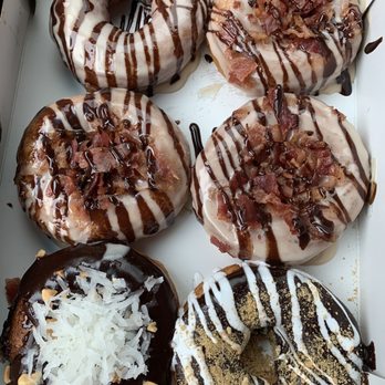 Duck Donuts - Clockwise. Maple chocolate bacon. S'mores. Coconut Island Bliss. Peanut butter chocolate. Mmmmmmm - Donuts Near Me - Arlington, Virginia Duck Donuts - Clockwise. Maple chocolate bacon. S'mores. Coconut Island Bliss. Peanut butter chocolate. Mmmmmmm - Donuts Near Me - Arlington, Virginia
