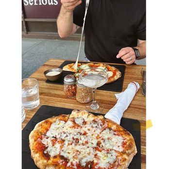 Serious Pie Downtown - Pepperoni pizza and a fresh mozzarella with basil pizza. - Pizza Near Me - Seattle, Washington Serious Pie Downtown - Pepperoni pizza and a fresh mozzarella with basil pizza. - Pizza Near Me - Seattle, Washington