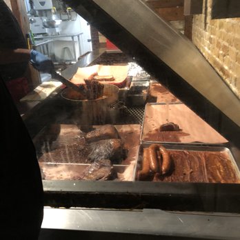 Cooper's Old Time Pit Bar-B-Que - Brisket and sausages at the front counter. - Barbeque Near Me - Austin, Texas