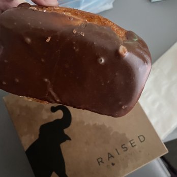 Raised Doughnuts and Cakes - Chocolate bar - Donuts Near Me - Seattle, Washington Raised Doughnuts and Cakes - Chocolate bar - Donuts Near Me - Seattle, Washington