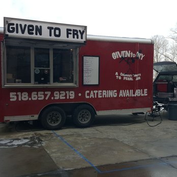 Given to Fry - a red food truck parked in a parking lot - Food Trucks Near Me