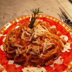 Magazzino - Pasta with pork belly, cheese, and tomato sauce.