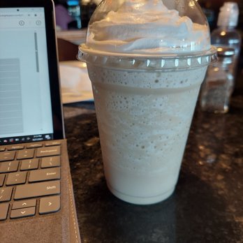 Classic Bean - a milkshake and a laptop on a table - Coffee & Tea Near Me - Topeka, Kansas