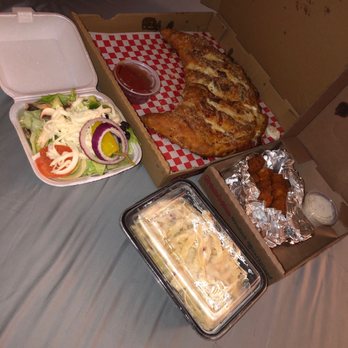 Dalia's Pizza - Upland - Omg!  ready to dig in. First time trying. Worth my money for sure. Calzone Fettucini Chicken Alfredo Boneless Wings house salad. - Pizza Near Me - Upland, California