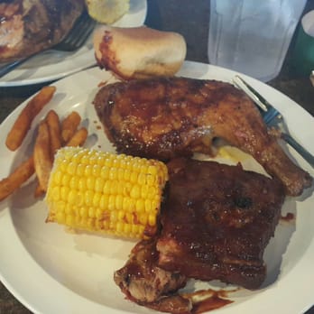 Corky's Ribs & BBQ - Part of the Smokehouse big tray, with ribs, chicken, fries and other sides. - Barbeque Near Me - Pigeon Forge, Tennessee