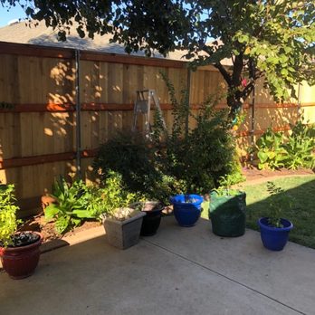 S&S Construction - a backyard with a lot of potted plants - Masonry/Concrete Near Me S&S Construction - a backyard with a lot of potted plants - Masonry/Concrete Near Me