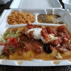 3 enchiladas after I smothered them with salsa & sour cream