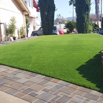 American Grass & Turf - a man working on a lawn - Landscaping Near Me - Dana Point, California