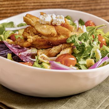 Artistry - a bowl of food on a table - Salad Near Me - Houston, Texas