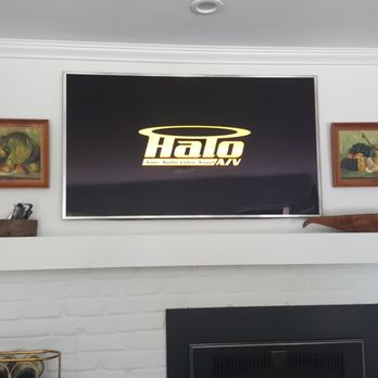 Halo A/V - TV mount on both sides of a two sided fireplace (Kitchen) - Home Theatre Installation Near Me Halo A/V - TV mount on both sides of a two sided fireplace (Kitchen) - Home Theatre Installation Near Me