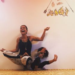 Wild Free Yogi Studio - My daughter and I trying to hold a pose. Always a silly moment!