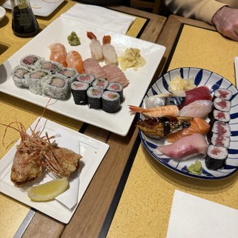 Mitama Restaurant - Nigiri set + Ala carte nigiri - A variety of sushi, sashimi, and tempura are displayed on plates at a Japanese restaurant, with soy sauce and wasabi nearby. - Japanese Near Me - Berkeley, California