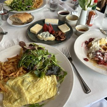 Sardine - Brie Mushroom Omelette, Half a Belgian Waffle, Plateau Du Fromage. - French Near Me - Madison, Wisconsin Sardine - Brie Mushroom Omelette, Half a Belgian Waffle, Plateau Du Fromage. - French Near Me - Madison, Wisconsin