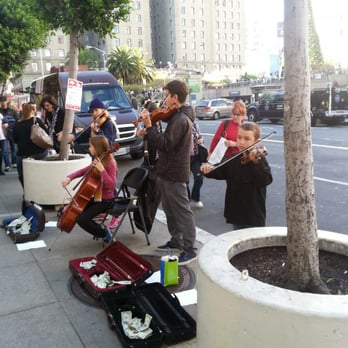 Macy's - Young violinists playing Christmas carols in front of Macy's - Department Stores Near Me - San Francisco, California Macy's - Young violinists playing Christmas carols in front of Macy's - Department Stores Near Me - San Francisco, California
