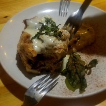 Manito Tap House - Bread Pudding. Fried basil and vanilla poppy seed sauce are the perfect complement to the berries and creamy bread pudding. - American Near Me - Spokane, Washington