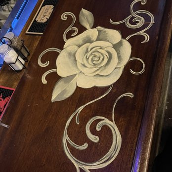 The Legendary Silver Dollar Saloon - The rose painted on the mahogany bar. - Irish Pub Near Me - Leadville, Colorado The Legendary Silver Dollar Saloon - The rose painted on the mahogany bar. - Irish Pub Near Me - Leadville, Colorado