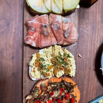 Postino Buckhead - Bruschetta (bottom to top - brussel sprout; curry chicken; fig and prosciutto; apple and bre - Wine Bars Near Me - Atlanta, Georgia Postino Buckhead - Bruschetta (bottom to top - brussel sprout; curry chicken; fig and prosciutto; apple and bre - Wine Bars Near Me - Atlanta, Georgia
