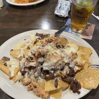 La Huerta Bar & Grill - Mixed fajita nachos and a modelo. - Bars Near Me - Springdale, Arkansas La Huerta Bar & Grill - Mixed fajita nachos and a modelo. - Bars Near Me - Springdale, Arkansas