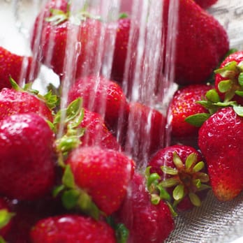Freshness Farms - a colander full of strawberries - Food Delivery Services Near Me